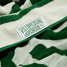 a green and white striped shirt with a label on the front that says, viebrequin ashridgey