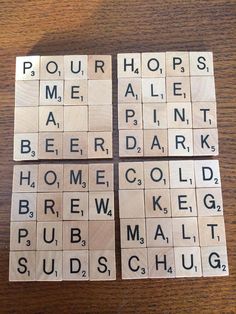 four scrabble tiles with words written on them