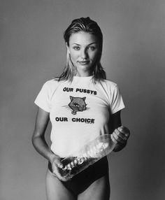 a woman holding a plastic bottle in her hands