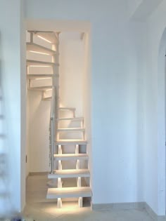 an empty room with some stairs in it