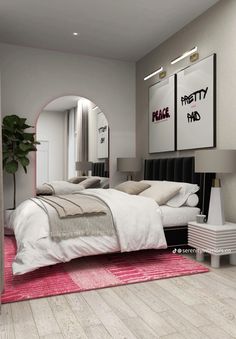 a bedroom with a bed, mirror and pink rug