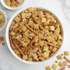 two white bowls filled with cheetos cereal