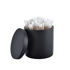 a black container with toothbrushes in it