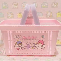 a pink plastic box with hello kitty on it