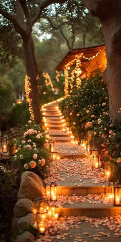 candles are lit on the steps leading to a house