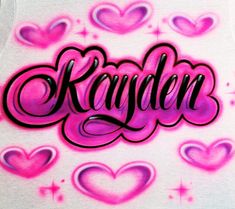 the word kanden written in graffiti on a white t - shirt with pink hearts