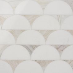 white marble tiles with circular shapes on them