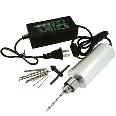 an electric device with many tools and wires on the side, including a charger