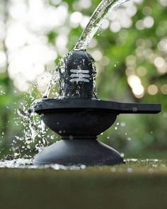 a water fountain spewing out from it's top