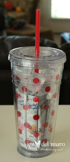 a plastic cup with red and white polka dots on it