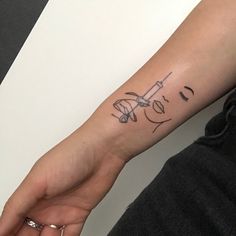 a person with a small tattoo on their arm