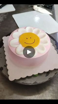 there is a cake with a smiley face on it