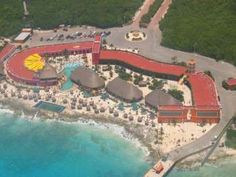 an aerial view of the resort and beach