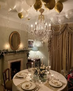 a dining room table is set with plates and place settings for two people to eat