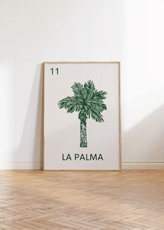 a green palm tree with the number 11 on it in front of a white wall