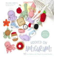 the cover of hooked on amigurum, featuring crochet toys and yarn