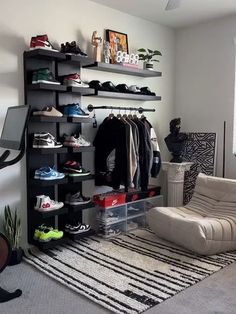 a living room filled with furniture and lots of shelves full of shoes on top of them