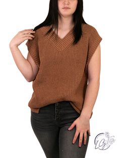 The "Joyful Memory Ribbed Sweater Vest" is a delightful blend of vintage charm and contemporary flair, designed to capture the essence of cherished moments while adding a touch of modern elegance to your wardrobe. The vest's versatile silhouette allows for creative styling, whether worn over a crisp white shirt for a preppy look or layered atop a casual tee for a relaxed and chic ensemble. Its thoughtful design allows you to create new memories while paying homage to the nostalgia of the past. F