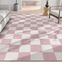 a pink and white checkered rug in a living room