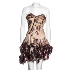 ▪ Roberto Cavalli silk corseted strapless mini dress ▪ cream, purple and metallic gold brocade printed silk ▪ Corseted bodice with asymmetric ruching and tucking ▪ Ruffled mini skirt with frayed hem ▪ Corset lace-up fastening at the back ▪ Size Small ▪ Fall-Winter 2004 ▪ 100% Silk ▪ Made in Italy Silk Strapless Corset Dress For Cocktail, Strapless Silk Corset Dress For Cocktail, Dress Fw, Dressing Outfits, Brocade Print, Silk Kimono Dress, Roberto Dress, Silk Corset, Silk Evening Dress