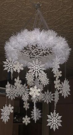 a chandelier with snowflakes hanging from it