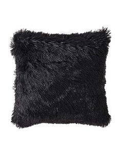 a black furry pillow on a white background