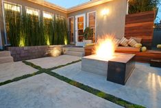 a fire pit sitting in the middle of a patio