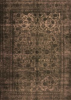 a brown and black rug with an intricate design