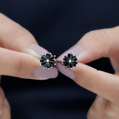 Product Details Add a pinch of spark to your outfit with these Stud Earrings, adorned with Marquise Shape Black Onyx Gemstone set in a floral pattern in Claw Setting. These lovely Floral Earrings are crafted in Solid Gold Metal Product Information SKU SHP-EARRINGS112112902 Length 9.5 mm Width 10 mm Weight 1.52 gm (Approximate) BLACK ONYX INFORMATION No.of Stones 24 Pieces Total Weight 3.10 Carat (Approximate) Dimension(approx) Marquise-2X4 mm-24 Pcs Color Black Cut Brilliant Shape Marquise Setti Black Earrings Outfit, Black Stone Earrings, Statement Stud Earrings, Earrings Outfit, Black Stud Earrings, Insta Profile, Fancy Earrings, Black Stud, Claw Setting