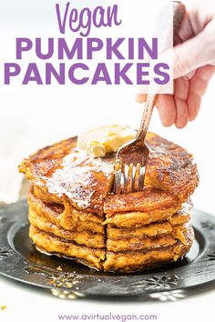 vegan pumpkin pancakes on a plate with butter and syrup being drizzled over them