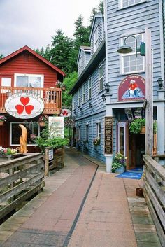 an alley way with shops and buildings on both sides