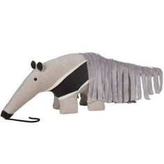 an animal made out of fabric with fringes on it