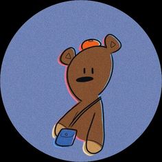 a brown teddy bear sitting on top of a blue circle