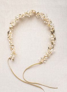 This decadent hair vine features gold plated leaf charms, Austrian crystals and freshwater pearls. This piece looks lovely as both a hair vine or bridal sash. -Adorned portion measures approximately 17.5 inches at its longest by 1.75 inches at its widest -Austrian crystals and freshwater pearls -Crystals are opal colored -Hand wired -Available in gold as pictured -Finished with gold ribbons for a self tie fit -Flexible Pearl Bridal Hair, Gold Hair Vine, Wedding Hairband, Hair Accessories Pearl, Bridal Hair Vine, Bridal Sash, Pearl Bridal, Crystal Crown, Opal Color