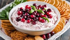 cranberry dip in a bowl surrounded by crackers