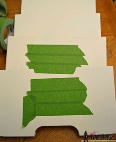 three pieces of paper cut out to look like leaves