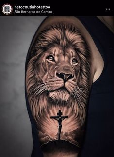 a lion with a cross on it's arm is shown in this tattoo design