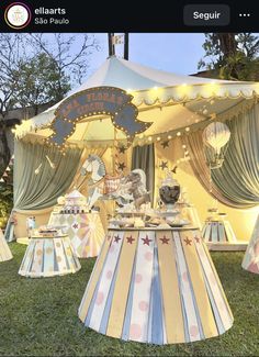 an outdoor carousel set up with lights and decorations