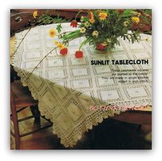 a table cloth with flowers on it and the words sunlit tablecloth written in english