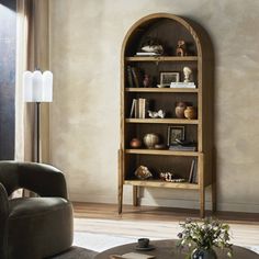 a living room filled with furniture and a book shelf