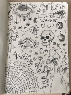 an open notebook with drawings on it