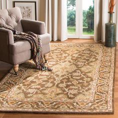 a living room area with a chair and rug