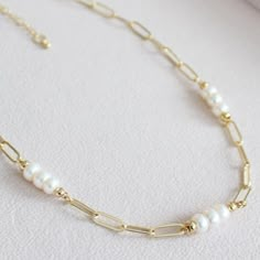 This Percy Pearl and 14k Gold Filled Paperclip chain necklace is the perfect piece to make a statement, but keep it low key. Crafted with nugget pearls, this subtle yet classy piece will be sure to turn heads. Upgrade your everyday style and your classic jewelry collection today!     * - 14K Gold Filled Paperclip chain with 5-6mm Freshwater nugget Pearls.    * -Each piece is handmade and pearls will differ in size, shape and colour slightly as they are naturally occurring.    * - 18 inch chain w Paperclip Necklace With Pendant, Classic Wedding Necklace With Paperclip Chain, Modern Pearl Jewelry Necklace, Chain And Pearl Necklace, Modern Pearl Jewelry, Diy Pearl Necklace, Chain Necklace Diy, Accessories Classy, Gold Link Necklace