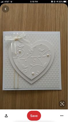 a white card with a heart on it