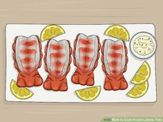 four pieces of meat on a plate with lemon slices