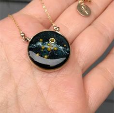 This Custom Solar System Necklace has glowing glass microbeads carefully hand placed to create our sun and planets on a backdrop of the shimmering milky way galaxy. The planets and galaxy float in a sparkling inky resin that is covered with a clear dome, adding dimensions and depth to this celestial scene.Your custom stamping is placed on the edge of the pendant as a way to remember a special place, person, or date.If you would like to have a constellation placed on the milky way background inst Celestial Resin Jewelry As Gift, Celestial Resin Jewelry As A Gift, Celestial Resin Jewelry For Gifts, Celestial Style Resin Jewelry For Gifts, Milky Way Background, Sun And Planets, Solar System Necklace, Constellation Earrings, Galaxy Necklace