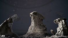 some very strange looking rocks in the middle of the night with a full moon behind them