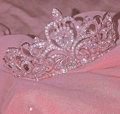 a tiara is sitting on top of a bed