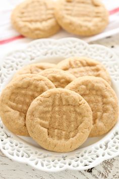 three peanut butter cookies on a white plate