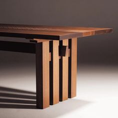 a wooden table sitting on top of a white floor